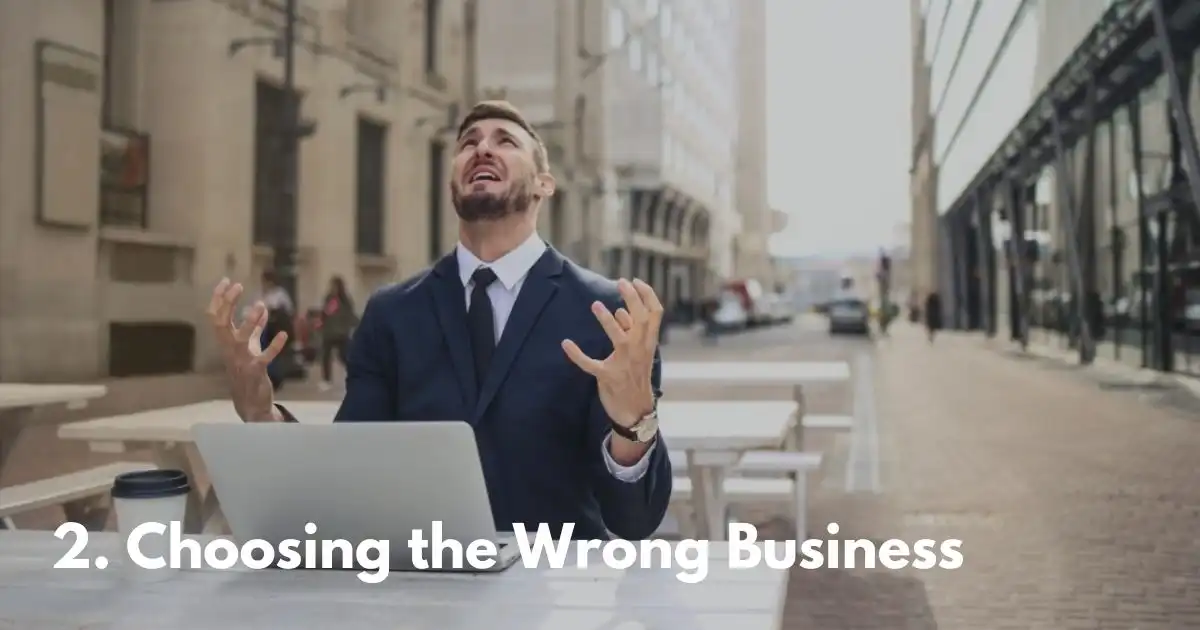 Frustrated man in suit expressing despair over wrong business choice.