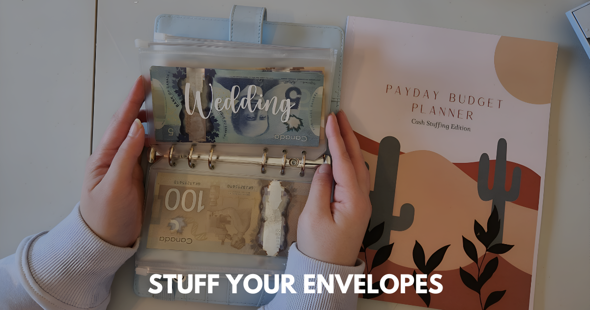 Hands holding labeled cash envelope binder beside a pastel-themed payday budget planner.