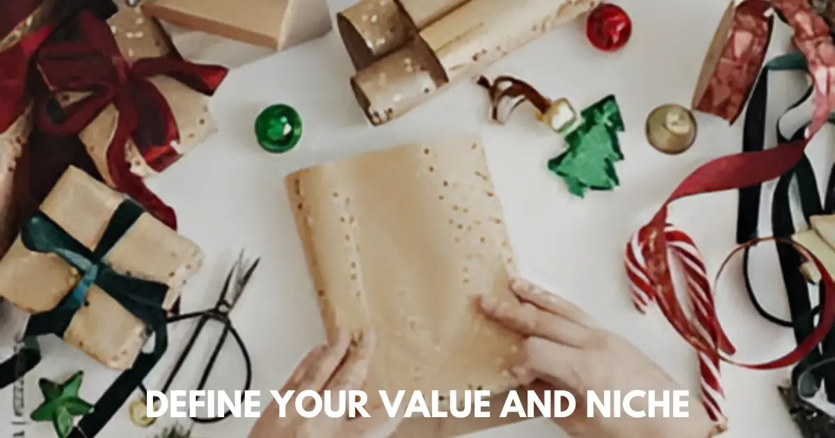 Hands wrapping gifts on a festive table with ribbons, ornaments, and paper rolls.