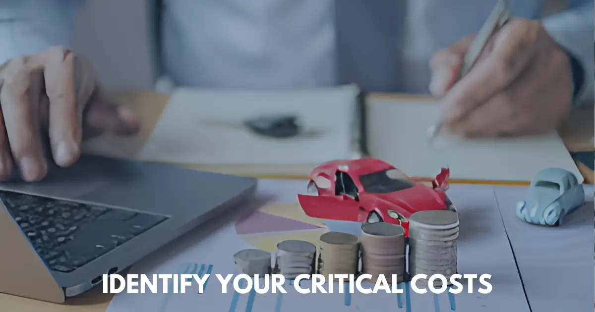 Stack of coins with a toy sports car and beatle, hand writing in notebook.