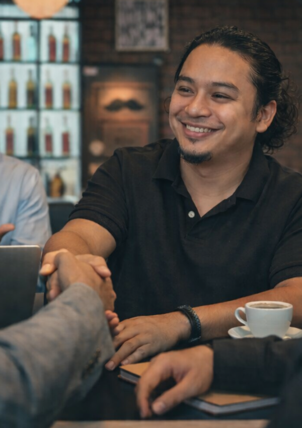 sam shake hands image with the clients